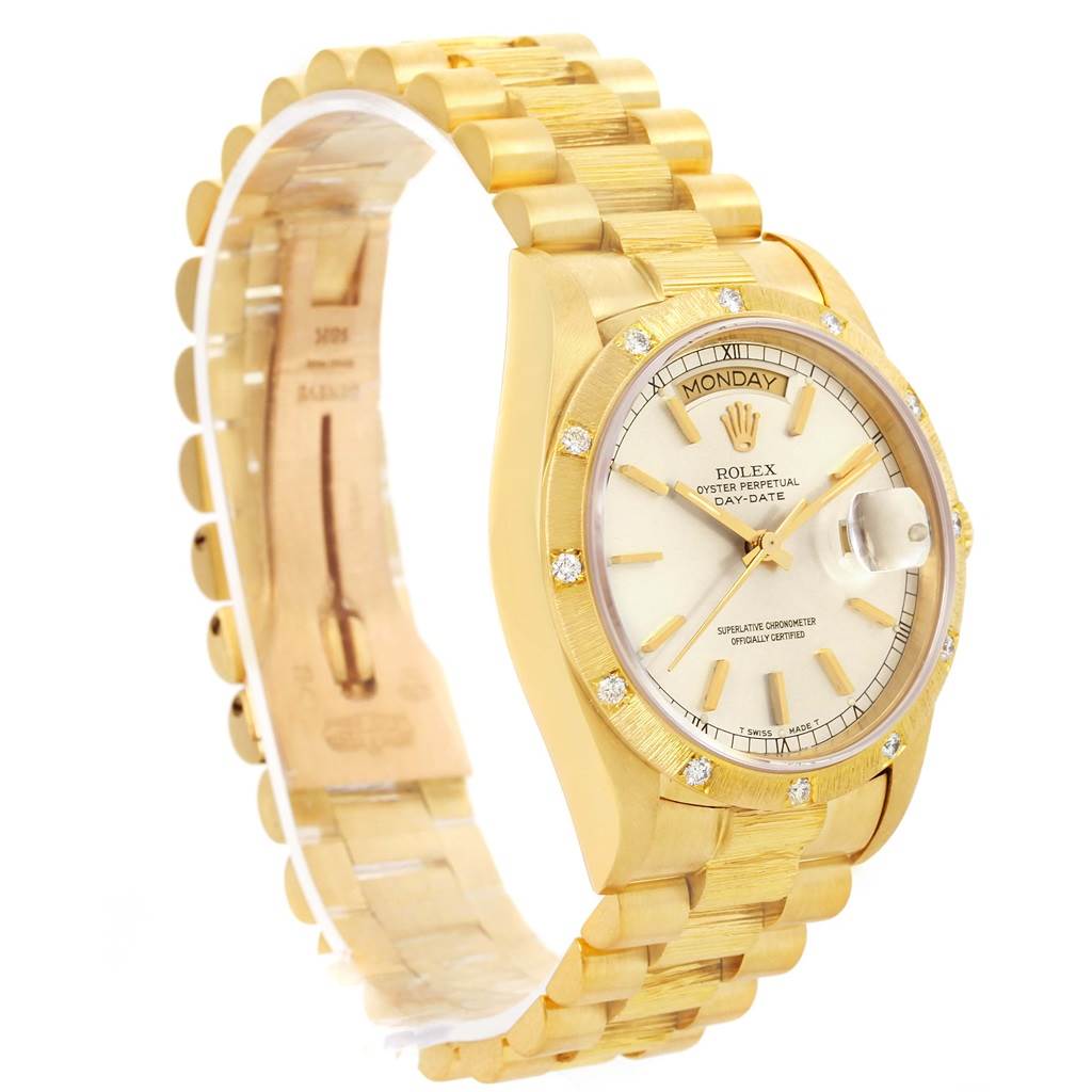 The image shows a side angle of the Rolex President 18078 Men
s Yellow Gold Silver Dial 18078 Men
s Yellow Gold Silver Dial model watch, highlighting its gold bracelet, dial, and day-date feature.