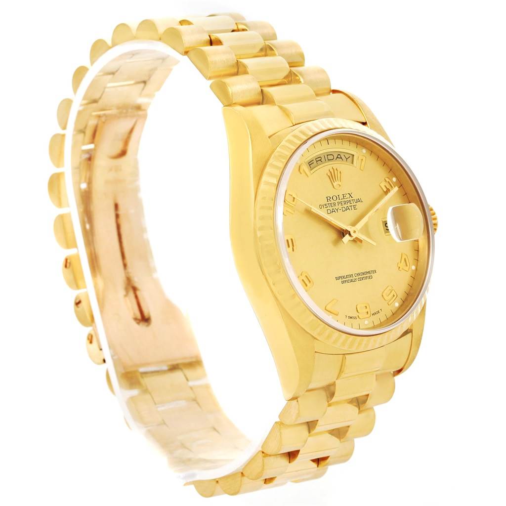 The image shows a Rolex President 18238 Men
s Yellow Gold Champagne Dial 18238 Men
s Yellow Gold Champagne Dial model watch angled in a way that highlights the bracelet, case, and dial.