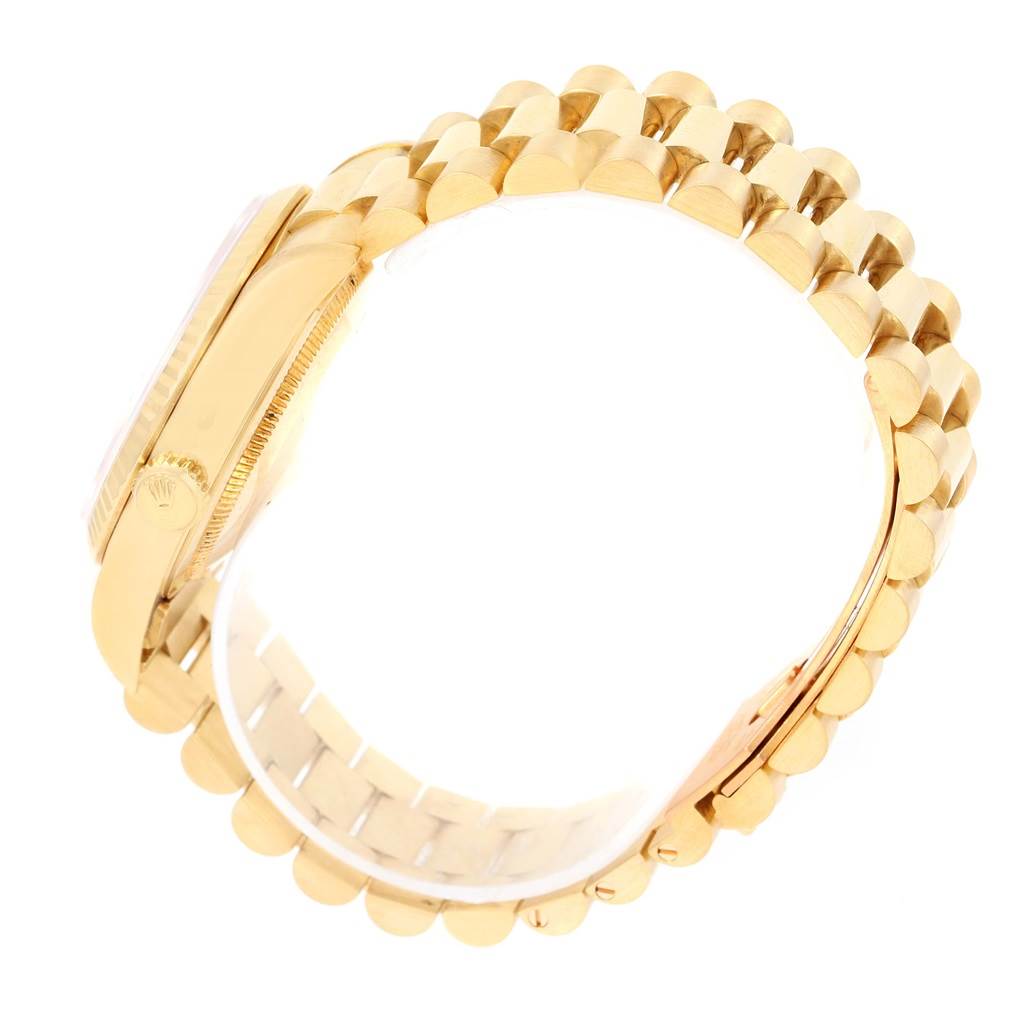 The image shows a side angle of the Rolex President 18238 Men's Yellow Gold White Dial 18238 Men's Yellow Gold White Dial model watch, highlighting the gold bezel, crown, and the bracelet band.