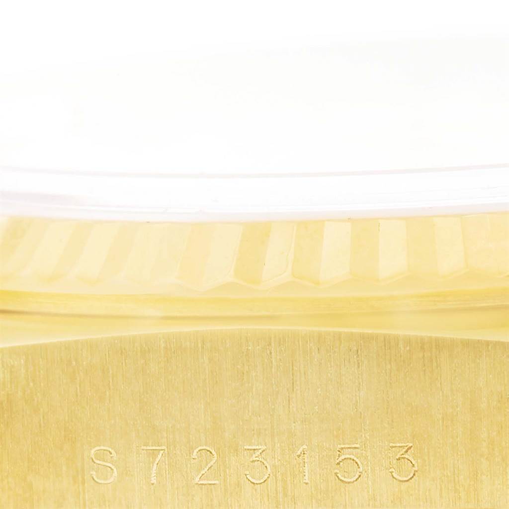 This close-up image shows the side and serial number of a Rolex President 18238 Men's Yellow Gold White Dial 18238 Men's Yellow Gold White Dial model watch.