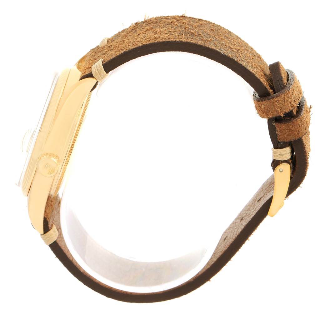 This image shows a side view of a Rolex President 1803 Men's Yellow Gold Silver Dial 1803 Men's Yellow Gold Silver Dial watch, highlighting its case, crown, and leather strap.