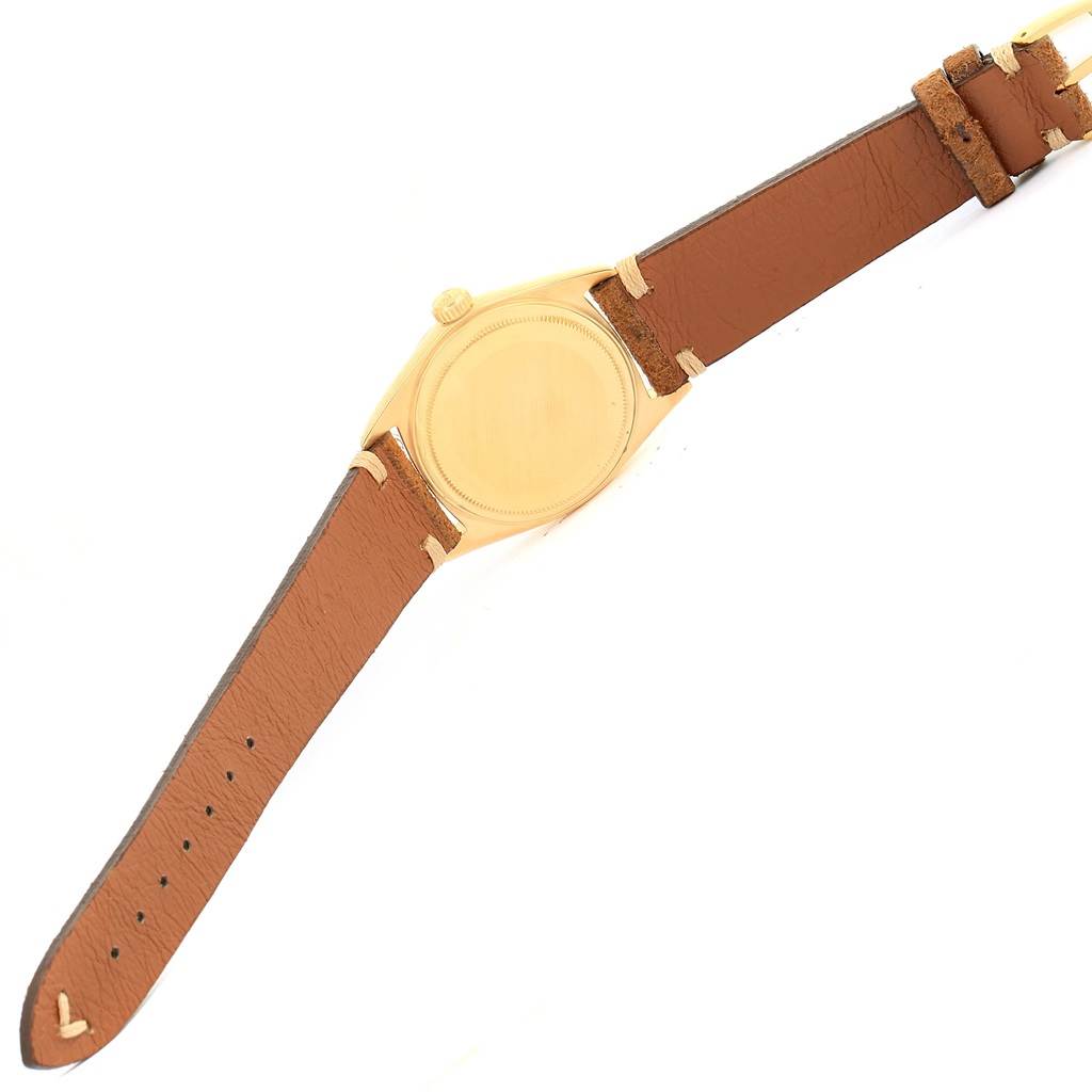 This image shows the back and side of a Rolex President 1803 Men's Yellow Gold Silver Dial 1803 Men's Yellow Gold Silver Dial model watch with a brown leather strap.