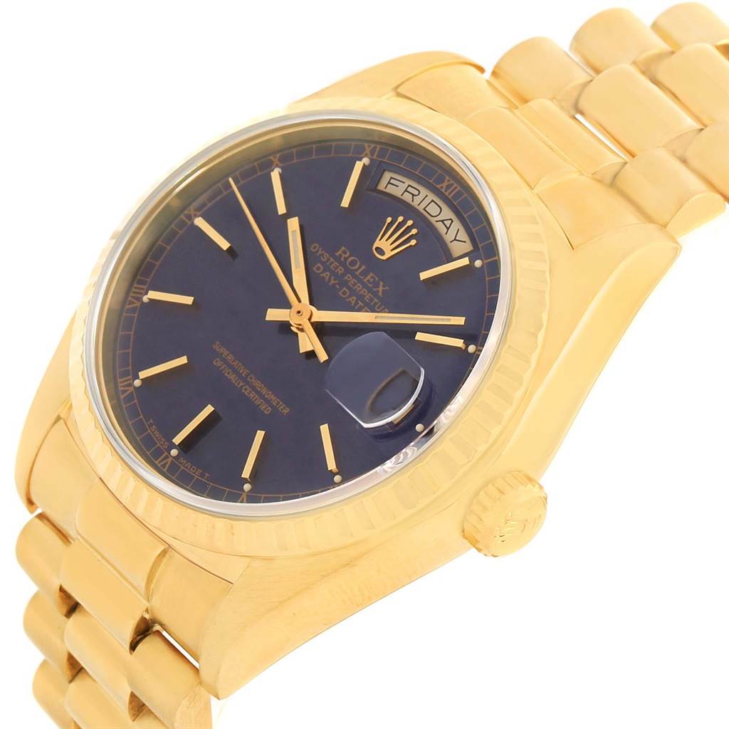 The image shows a Rolex President 18038 Men
s Yellow Gold Blue Dial 18038 Men
s Yellow Gold Blue Dial model watch at an angled view, highlighting the dial, bezel, crown, and bracelet.