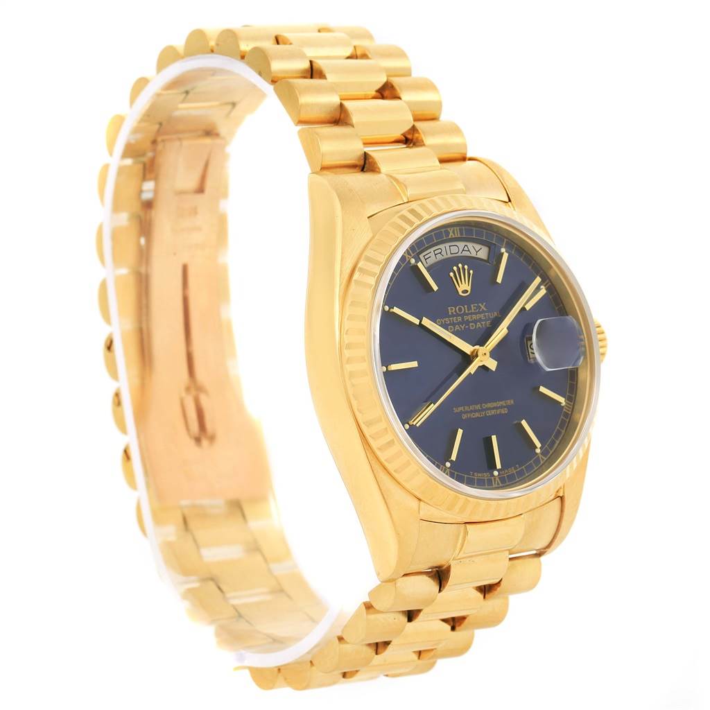 This image shows a side view of a Rolex President 18038 Men
s Yellow Gold Blue Dial 18038 Men
s Yellow Gold Blue Dial model watch, highlighting its gold bracelet, case, and blue dial.