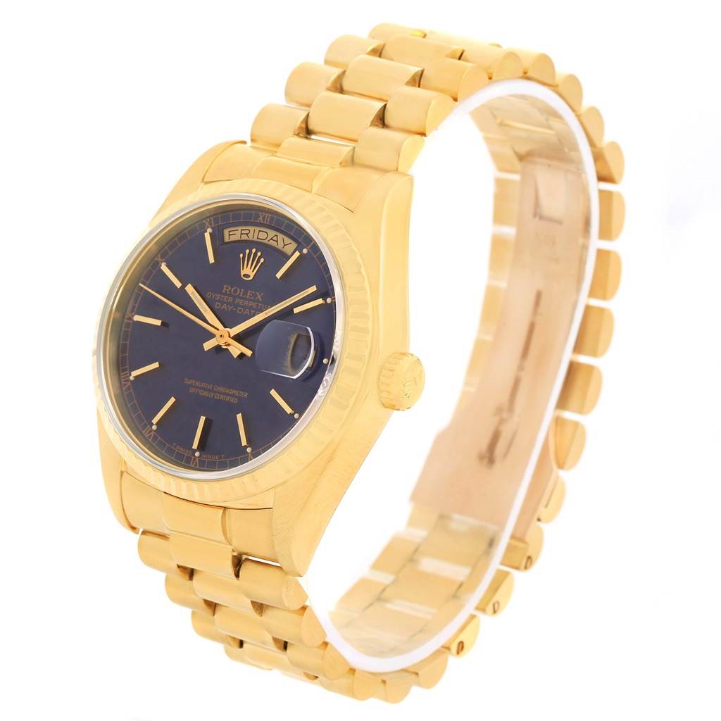 The Rolex President 18038 Men
s Yellow Gold Blue Dial 18038 Men
s Yellow Gold Blue Dial model is shown at an angle emphasizing the gold bracelet and black dial with date and day indicators.