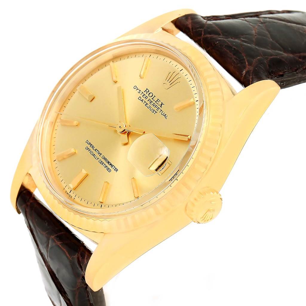 The Rolex President 1601 Men's Yellow Gold Champagne Dial 1601 Men's Yellow Gold Champagne Dial model watch is shown at an angled close-up, featuring its dial, crown, and partial strap.