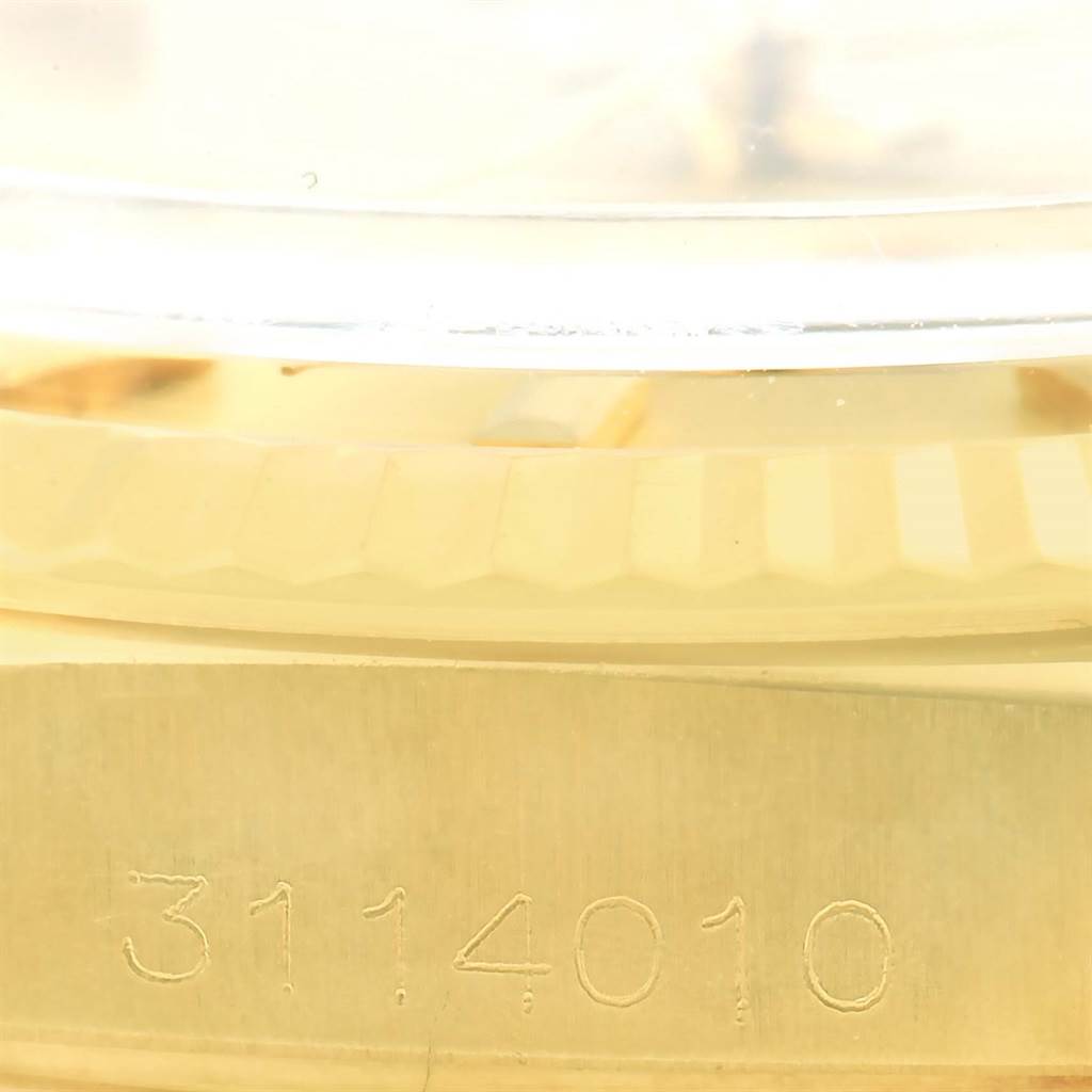 The image shows the side view of a Rolex President 1601 Men's Yellow Gold Champagne Dial 1601 Men's Yellow Gold Champagne Dial model watch, highlighting the serial number engraved on the case.