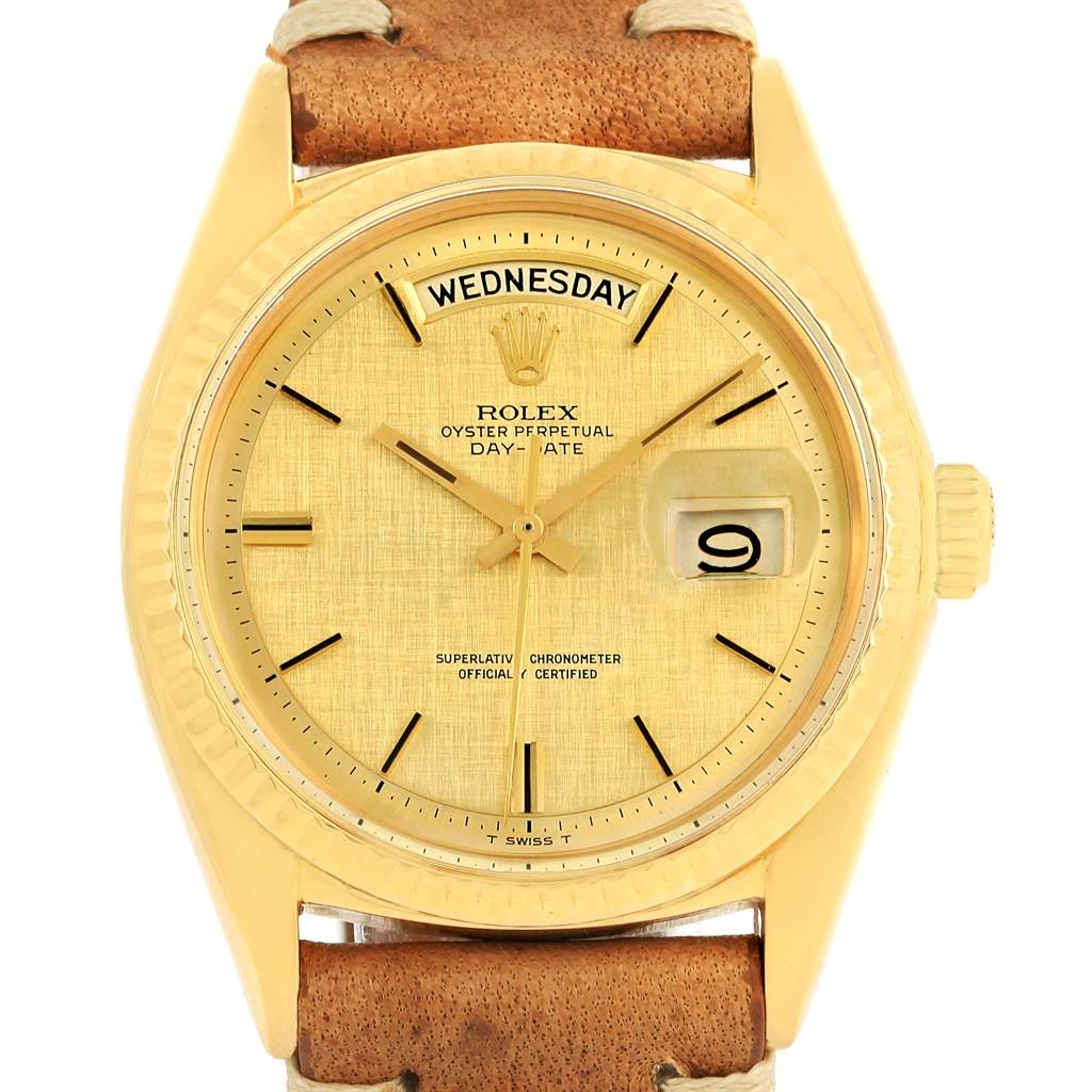 The image shows a frontal view of a Rolex President 1803 Men
s Yellow Gold Champagne Dial 1803 Men
s Yellow Gold Champagne Dial model watch, highlighting its gold case, day-date display, and brown leather strap.