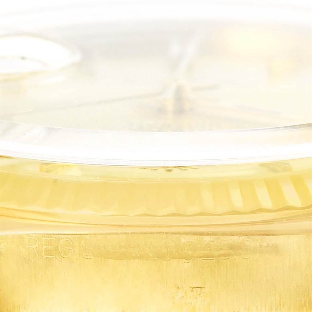 The image shows a close-up side view of the bezel and crystal of a Rolex President 1803 Men
s Yellow Gold Champagne Dial 1803 Men
s Yellow Gold Champagne Dial model watch.