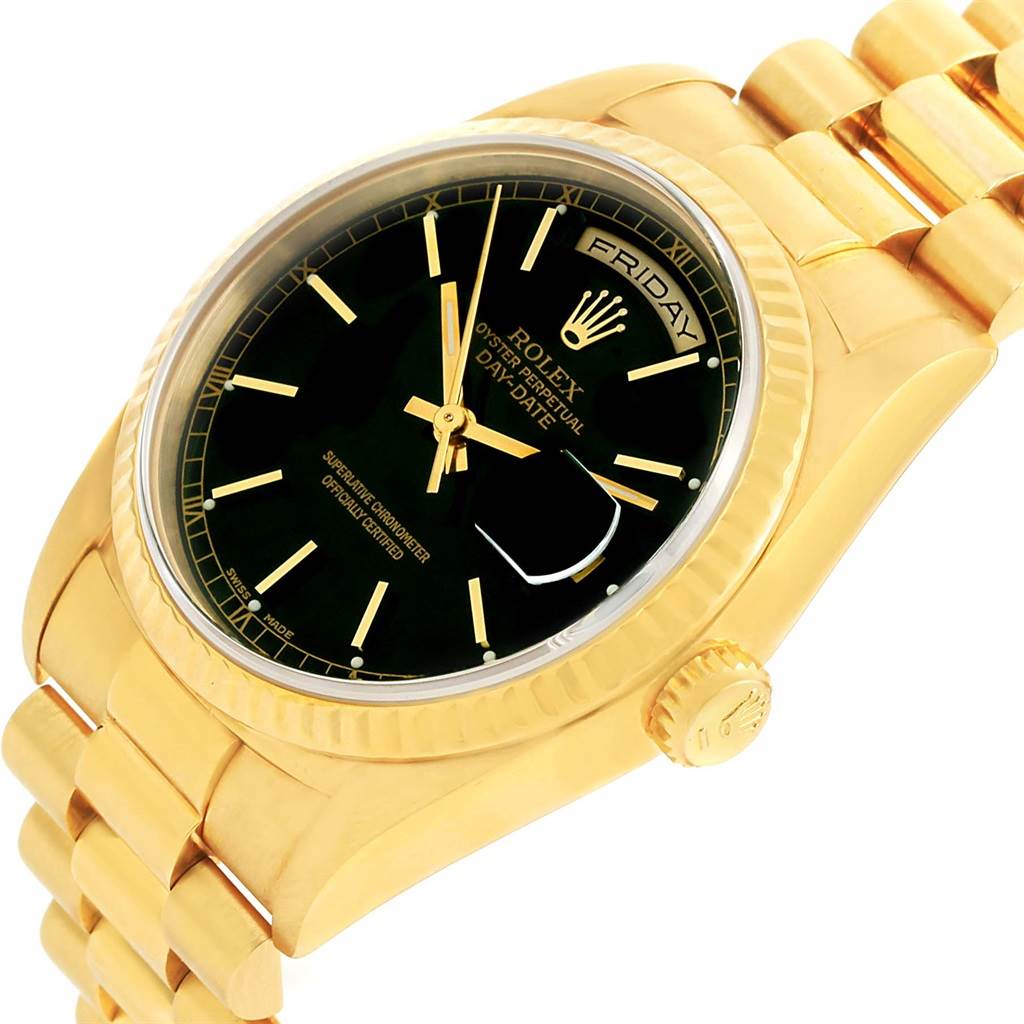 The image shows a President model Rolex watch at an angle, displaying the face, bezel, crown, and part of the bracelet.