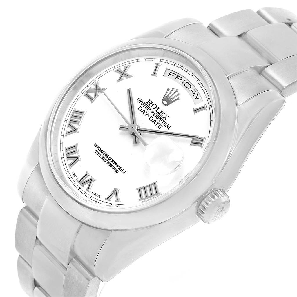 This image shows the Rolex President 118209 Men's White Gold White Dial 118209 Men's White Gold White Dial model watch from an angled top view, highlighting the dial, case, and part of the bracelet.
