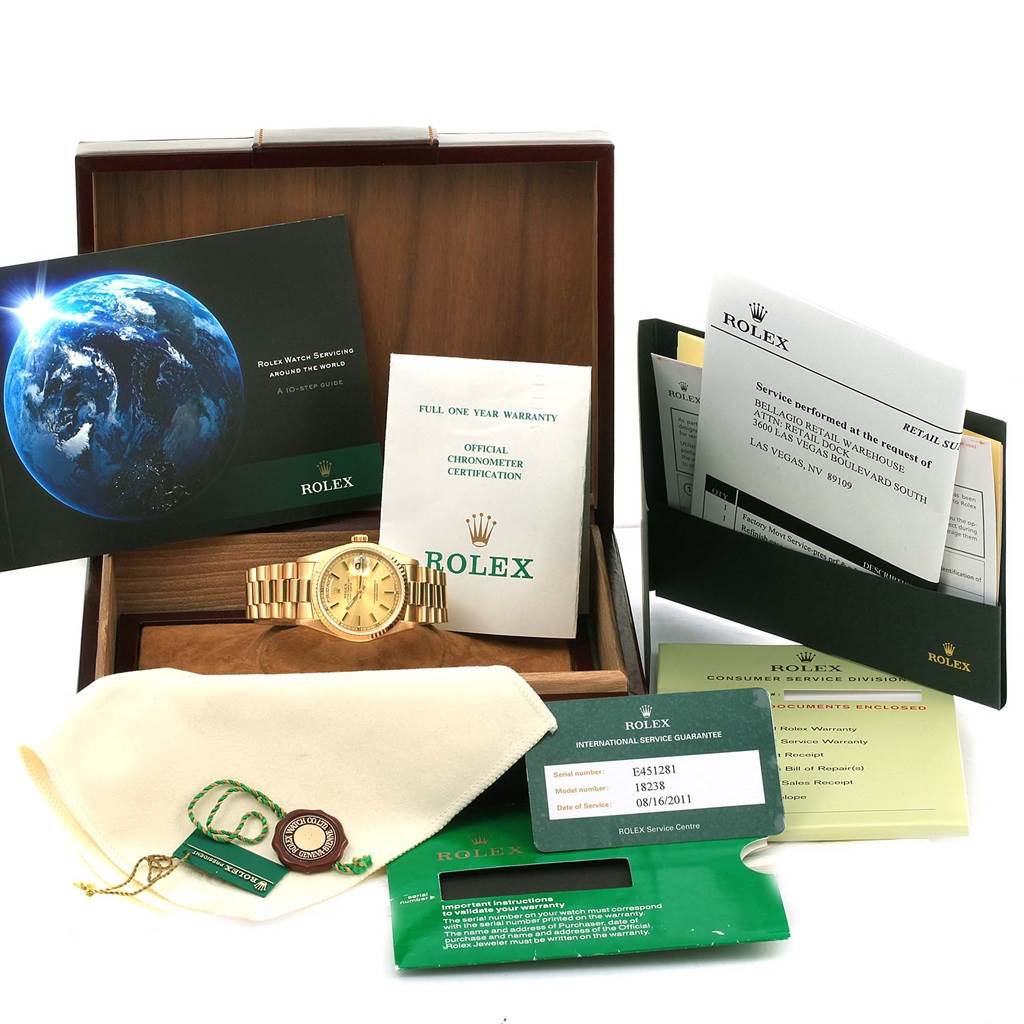 The Rolex President 18238 Men
s Yellow Gold Champagne Dial 18238 Men
s Yellow Gold Champagne Dial model watch is displayed in its box with various accessories, including a warranty card, certificate, and informational booklets.