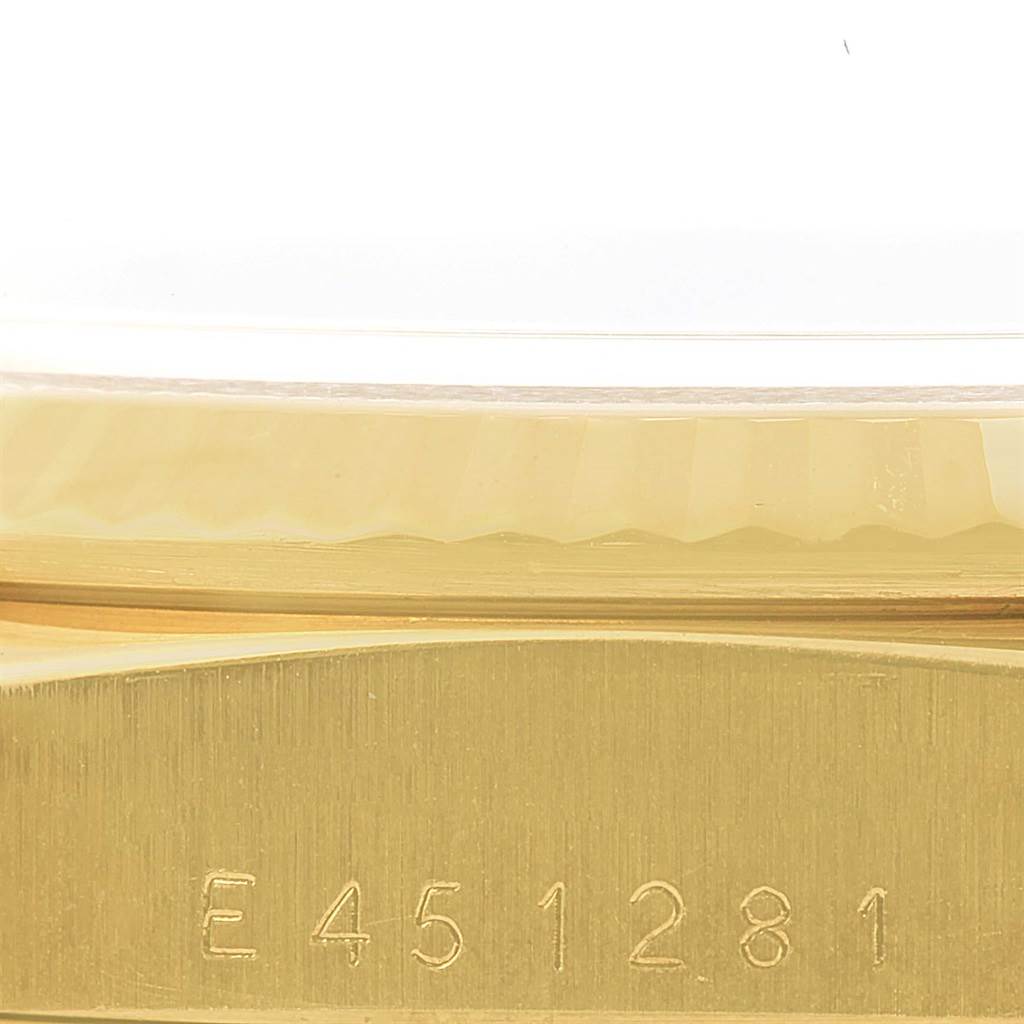 This image shows a close-up side view of the gold case and engraved serial number of a Rolex President 18238 Men
s Yellow Gold Champagne Dial 18238 Men
s Yellow Gold Champagne Dial watch.