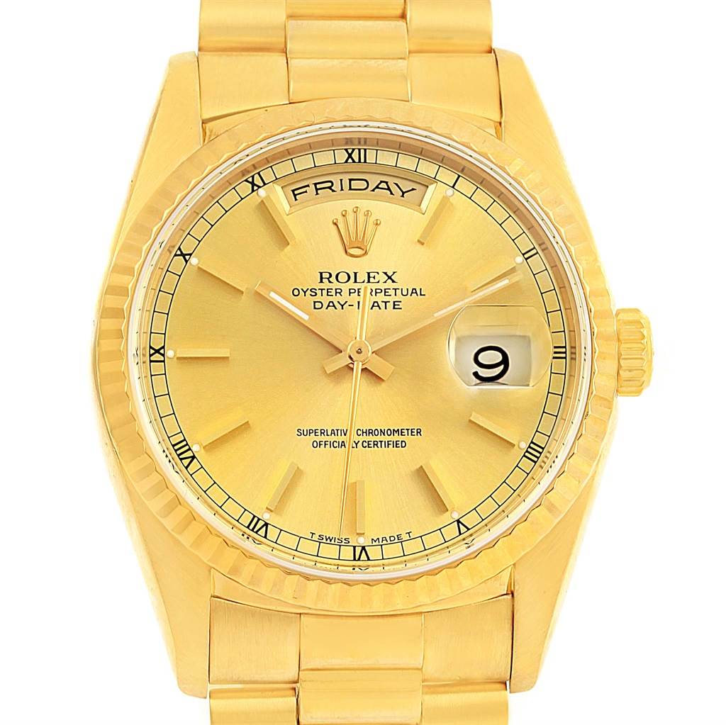 A frontal view of the Rolex President 18238 Men
s Yellow Gold Champagne Dial 18238 Men
s Yellow Gold Champagne Dial model watch displaying the dial, day, date, and part of the bracelet.
