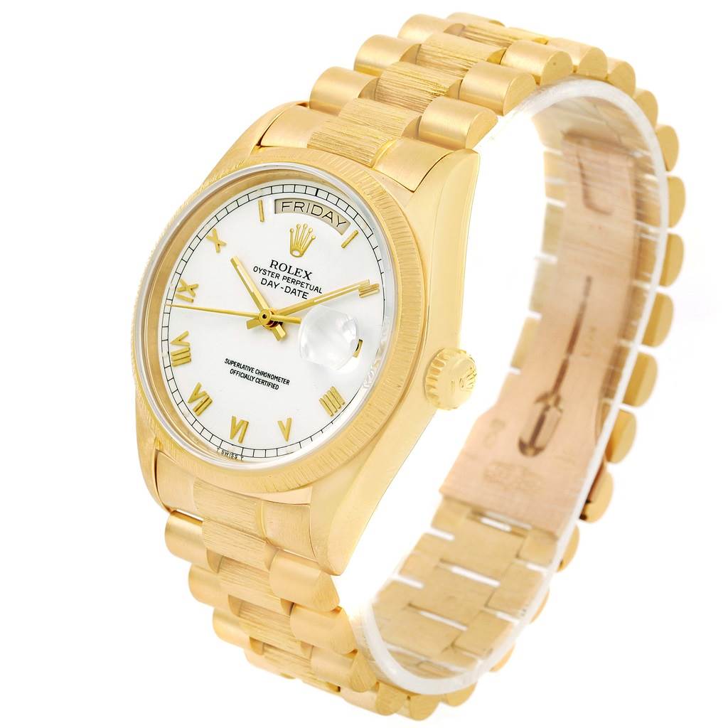 This image shows a side angle view of a Rolex President 18078 Men
s Yellow Gold White Dial 18078 Men
s Yellow Gold White Dial model watch, highlighting the gold bracelet, crown, and white dial.