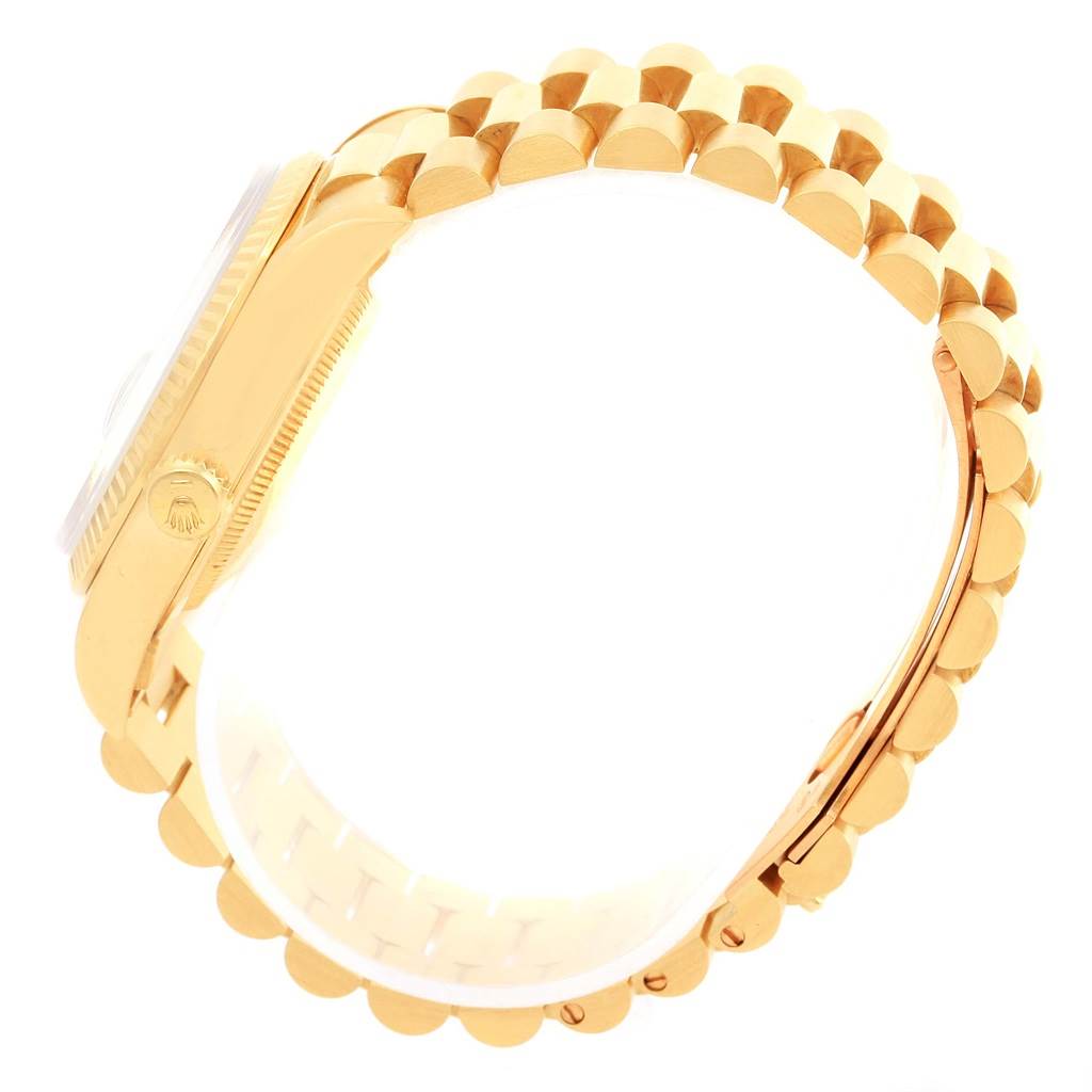 This image shows a side view of the Rolex President 18238 Men
s Yellow Gold White Dial 18238 Men
s Yellow Gold White Dial model watch, highlighting its gold case and bracelet.