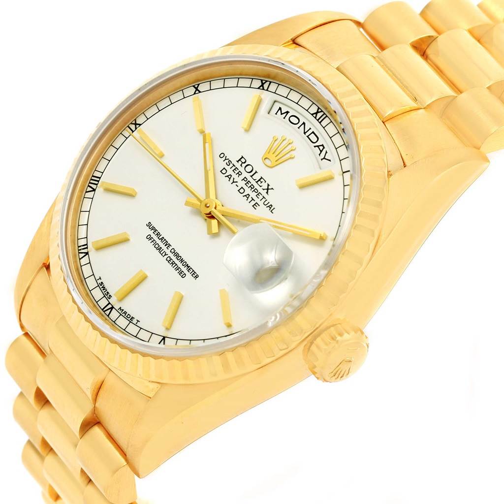 This Rolex President 18238 Men
s Yellow Gold White Dial 18238 Men
s Yellow Gold White Dial model watch is shown at an oblique angle, displaying the face, bracelet, case, and crown.