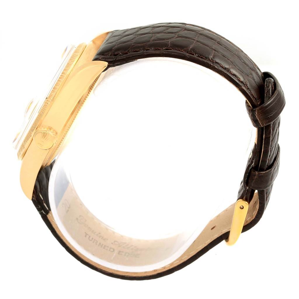 This image shows a side profile of the Rolex President 1807 Men
s Yellow Gold Champagne Dial 1807 Men
s Yellow Gold Champagne Dial model watch, highlighting its gold case and brown leather strap.