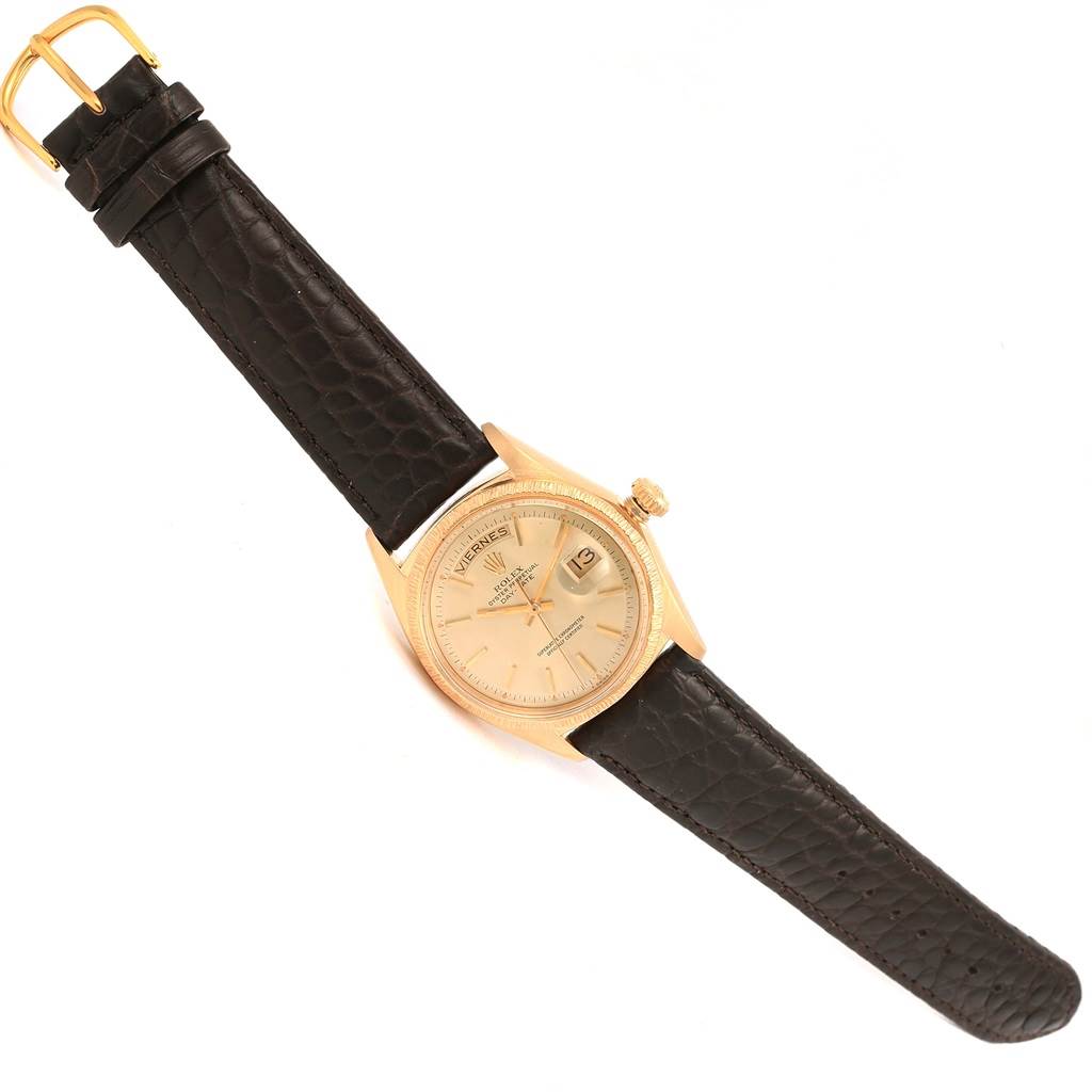 This image shows a Rolex President 1807 Men
s Yellow Gold Champagne Dial 1807 Men
s Yellow Gold Champagne Dial watch model laid flat, showcasing the dial, bezel, strap, crown, and buckle from a slight top-down angle.