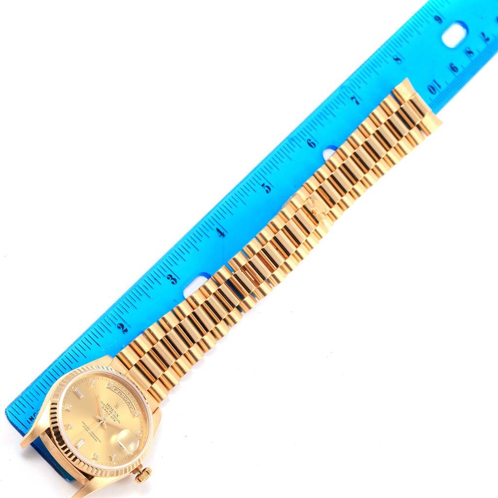 The image shows the face and band of a Rolex President 18238 Men's Yellow Gold Champagne Dial 18238 Men's Yellow Gold Champagne Dial watch, aligned next to a blue ruler for measurement.