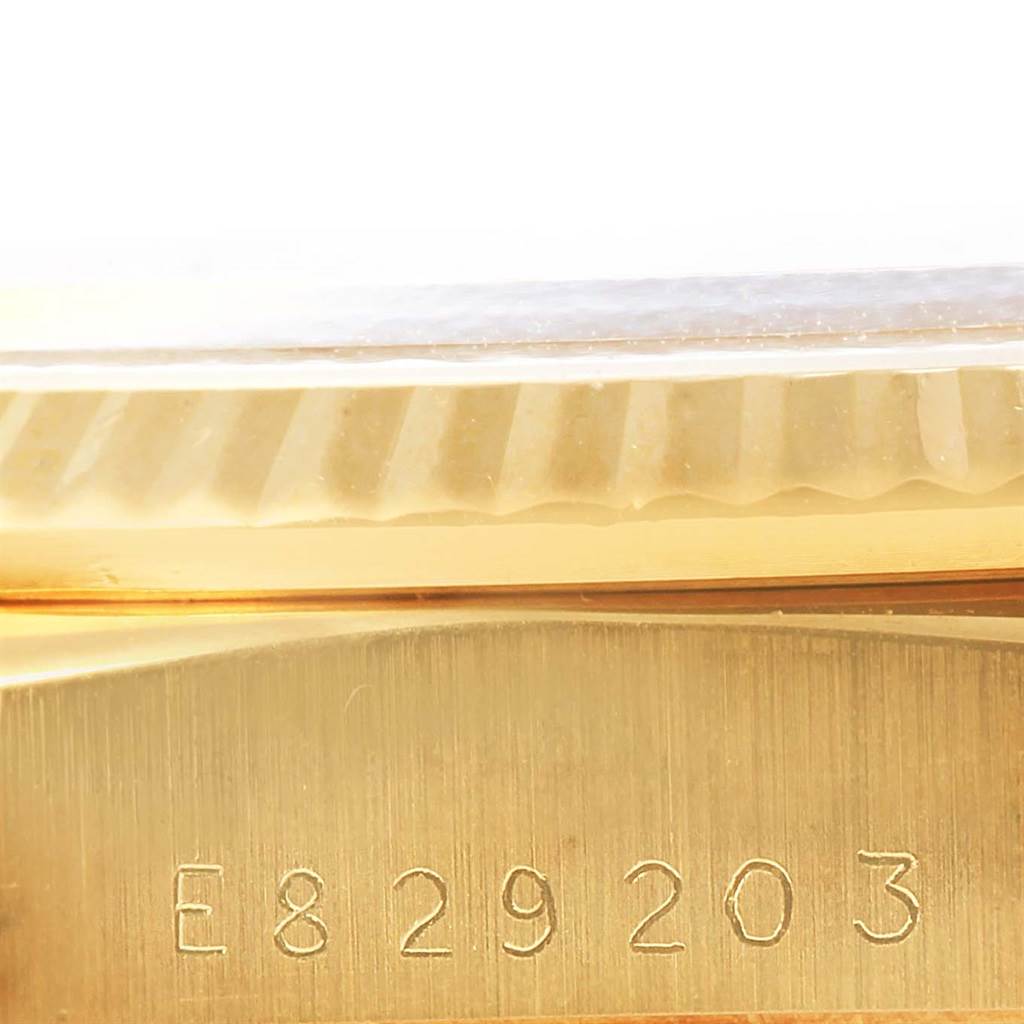 This close-up angle shows the case and serial number engraving of a Rolex President 18238 Men's Yellow Gold Champagne Dial 18238 Men's Yellow Gold Champagne Dial model watch.