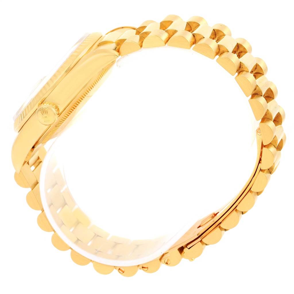 The image shows a side view of a gold Rolex President 18238 Men's Yellow Gold Champagne Dial 18238 Men's Yellow Gold Champagne Dial model watch, featuring its case, crown, and bracelet.