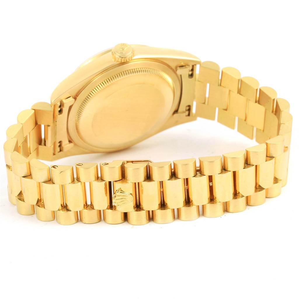 This image shows the back view of a Rolex President 18238 Men's Yellow Gold Champagne Dial 18238 Men's Yellow Gold Champagne Dial model, highlighting the case back and part of the bracelet.