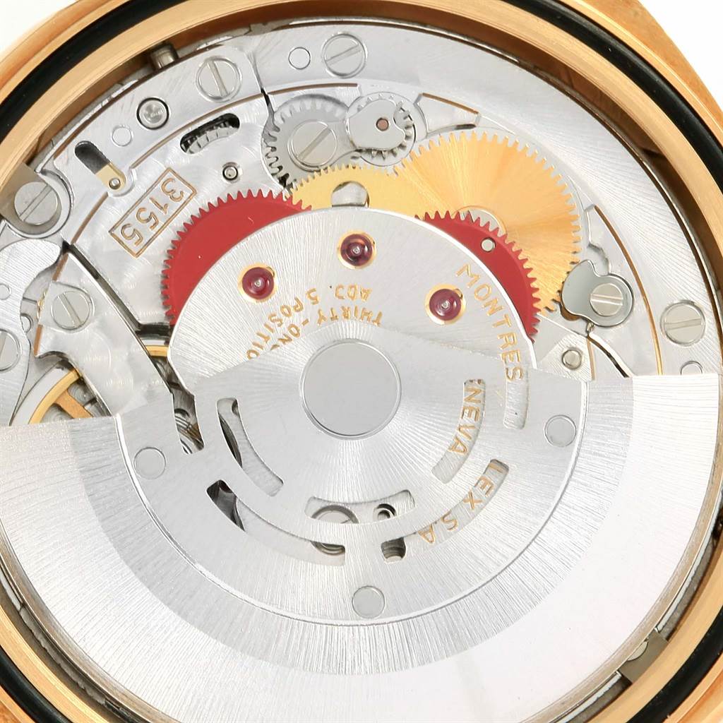 The image shows the intricate internal mechanism of a Rolex President 18238 Men
s Yellow Gold Champagne Dial 18238 Men
s Yellow Gold Champagne Dial model watch from a close-up perspective.