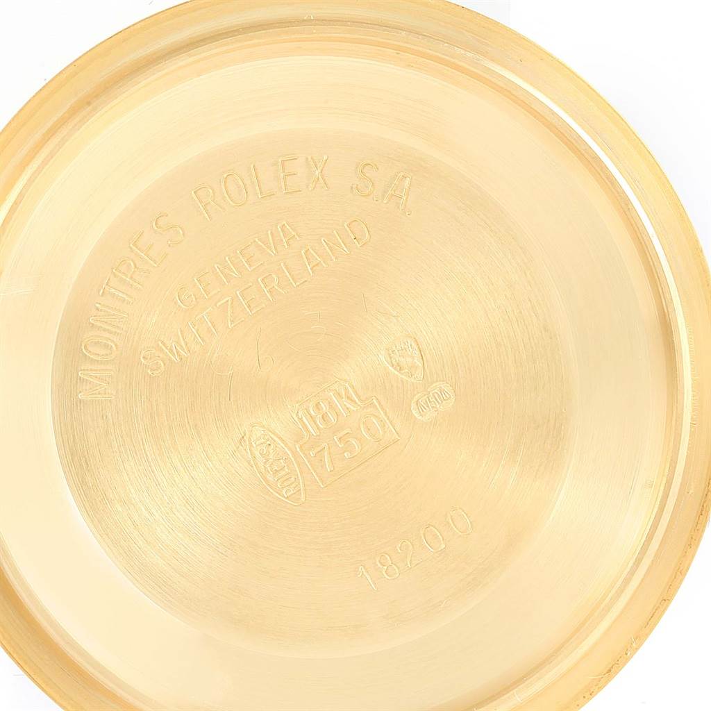 This image shows the inner part of the case back of a Rolex President 18238 Men
s Yellow Gold Champagne Dial 18238 Men
s Yellow Gold Champagne Dial watch, displaying branding and material information.