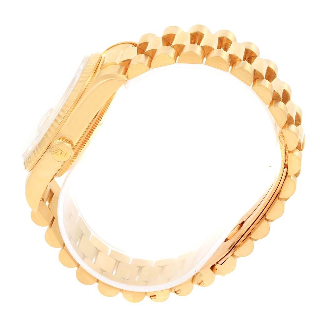 The image shows a side view of a Rolex President 18238 Men
s Yellow Gold Champagne Dial 18238 Men
s Yellow Gold Champagne Dial model watch, highlighting its gold case, bezel, and bracelet.