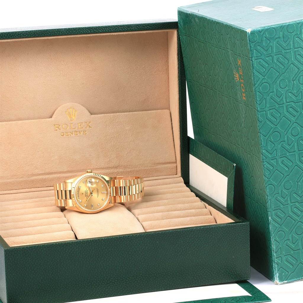 The Rolex President 18238 Men
s Yellow Gold Champagne Dial 18238 Men
s Yellow Gold Champagne Dial model watch is shown inside its open green and beige presentation box, with the watch face and bracelet visible.