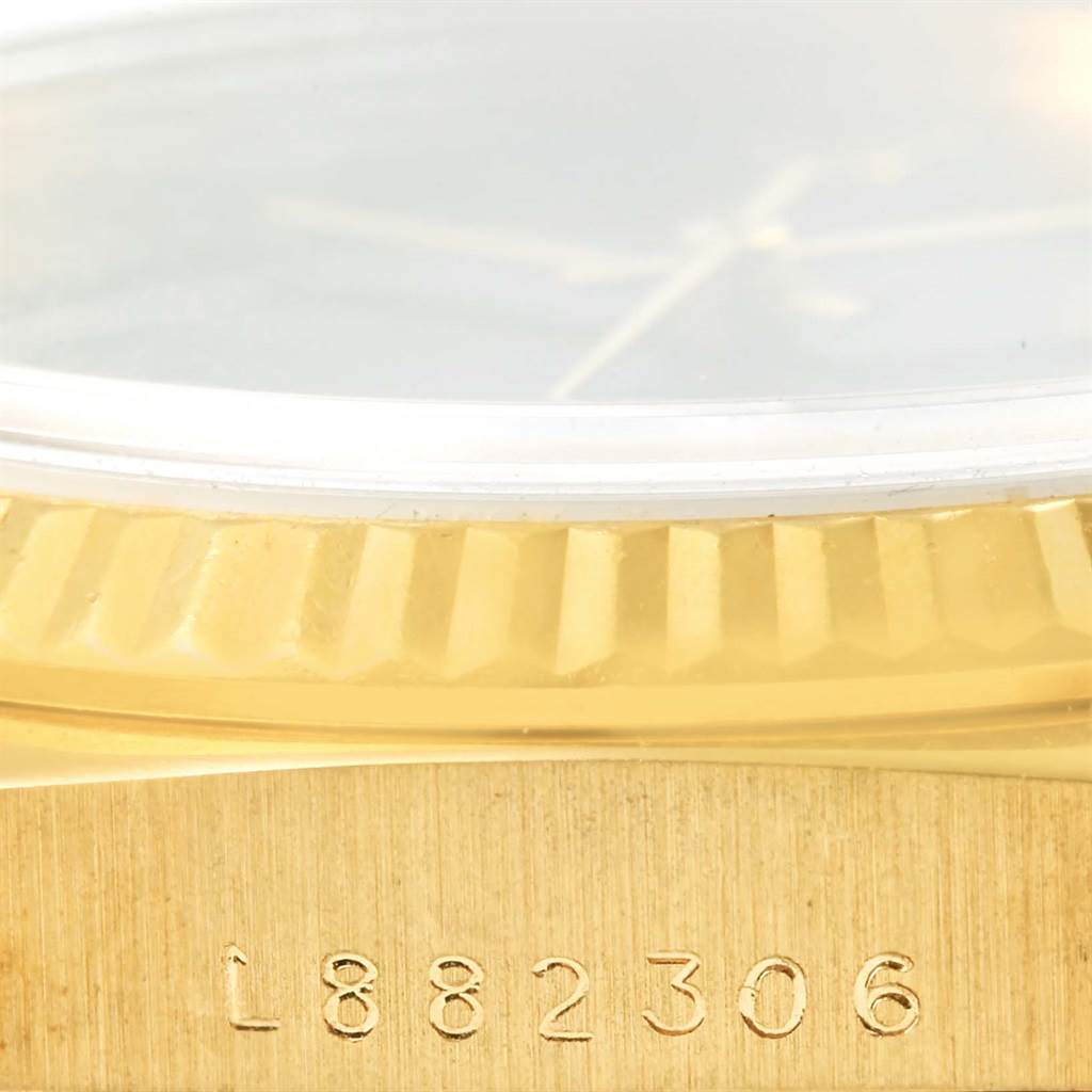 This close-up shows the serial number on the gold case of a Rolex President 15238 Men's Yellow Gold Black Dial 15238 Men's Yellow Gold Black Dial model watch.