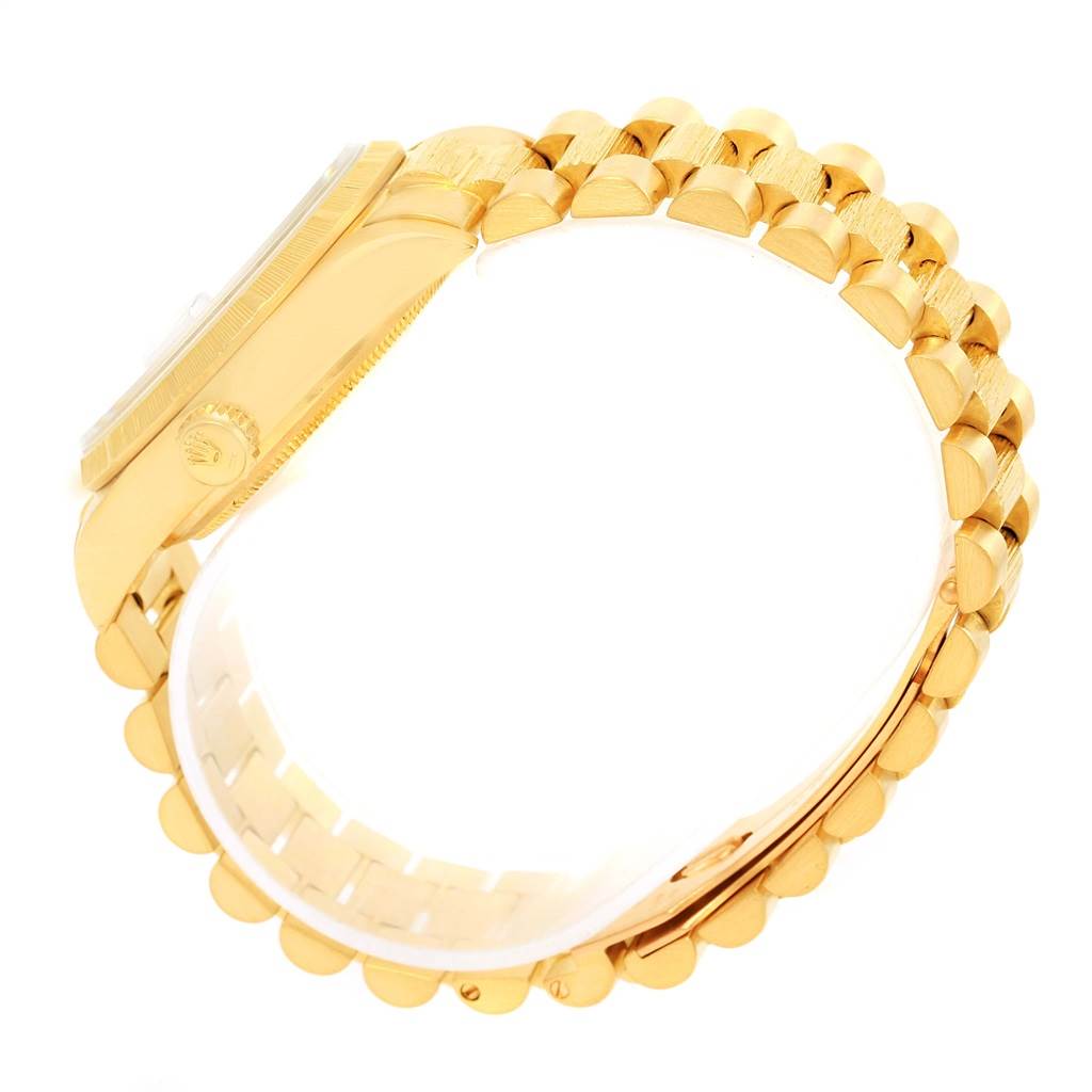 This image shows a side view of a Rolex President 18078 Men's Yellow Gold Blue Dial 18078 Men's Yellow Gold Blue Dial model watch, highlighting its gold case and bracelet.