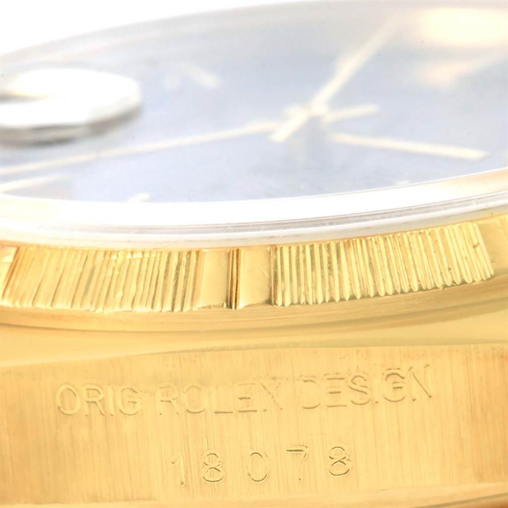 This close-up image shows the side view of a Rolex President 18078 Men's Yellow Gold Blue Dial 18078 Men's Yellow Gold Blue Dial model watch, highlighting the bezel and part of the case with model number 18078.