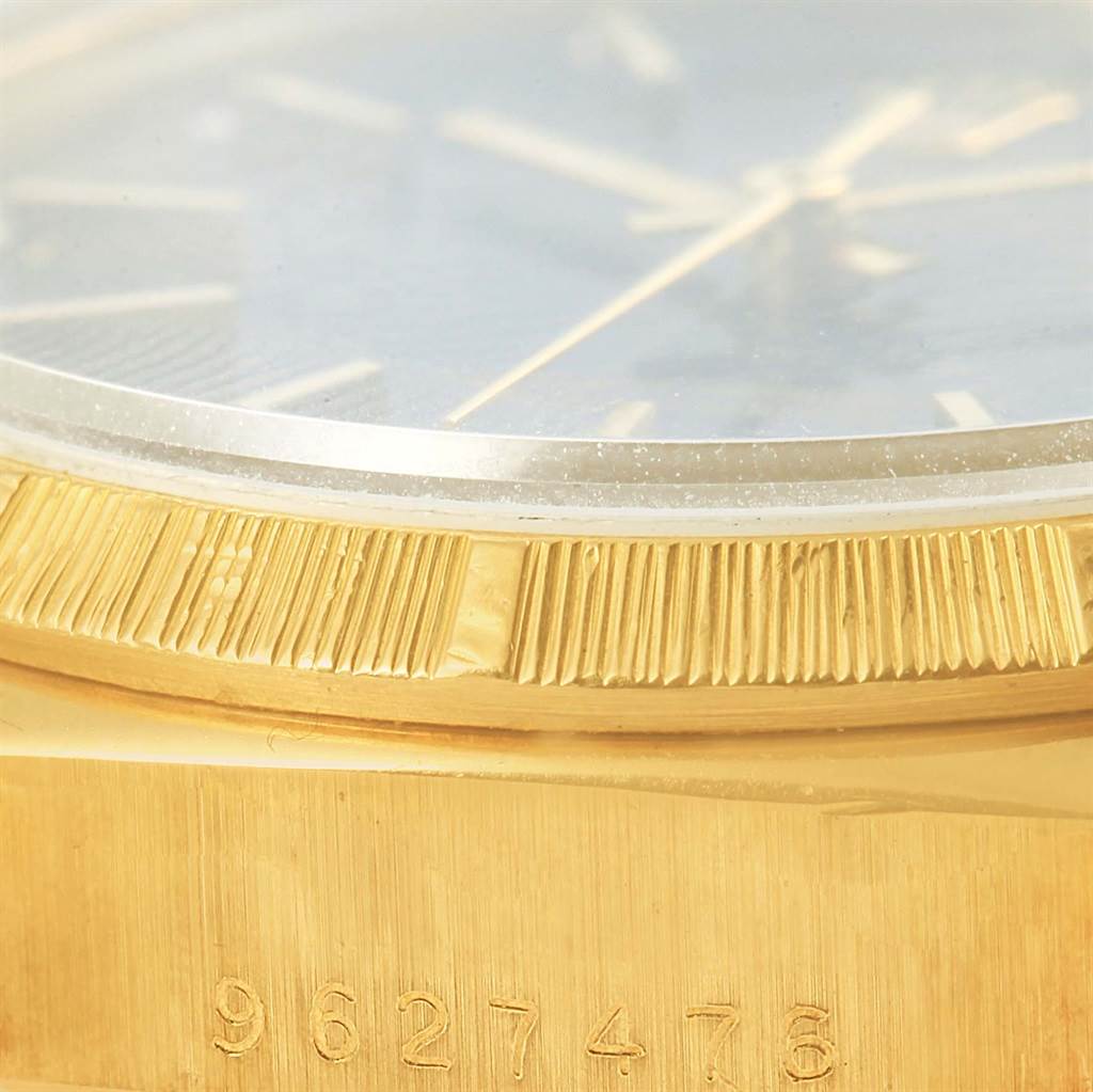 This image shows a close-up angle of the bezel and partial dial of a Rolex President 18078 Men's Yellow Gold Blue Dial 18078 Men's Yellow Gold Blue Dial model watch, highlighting the serial number.
