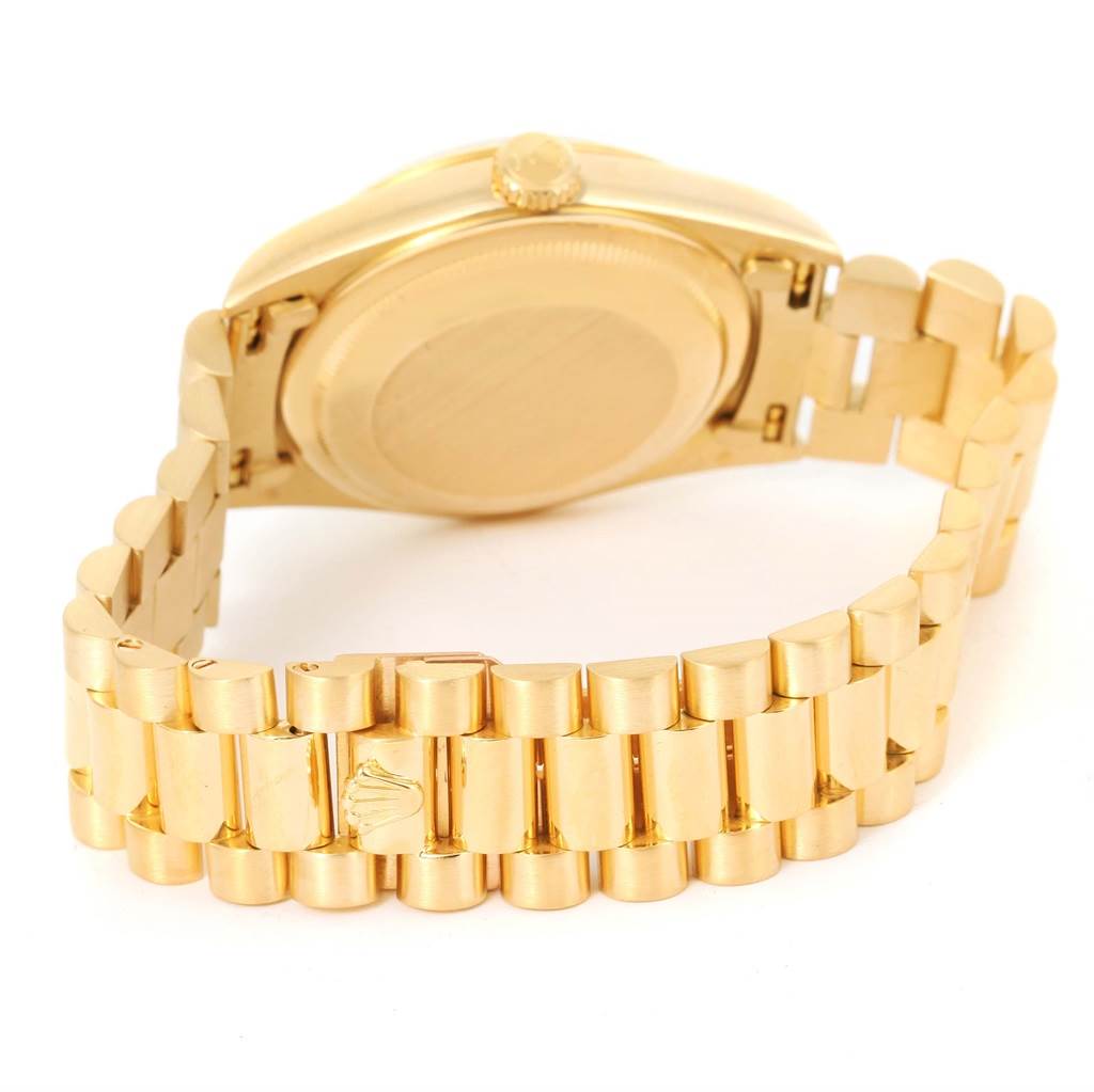 This image shows the back and bracelet of a gold Rolex President 18238 Men's Yellow Gold Champagne Dial 18238 Men's Yellow Gold Champagne Dial model watch from a slightly angled rear view.
