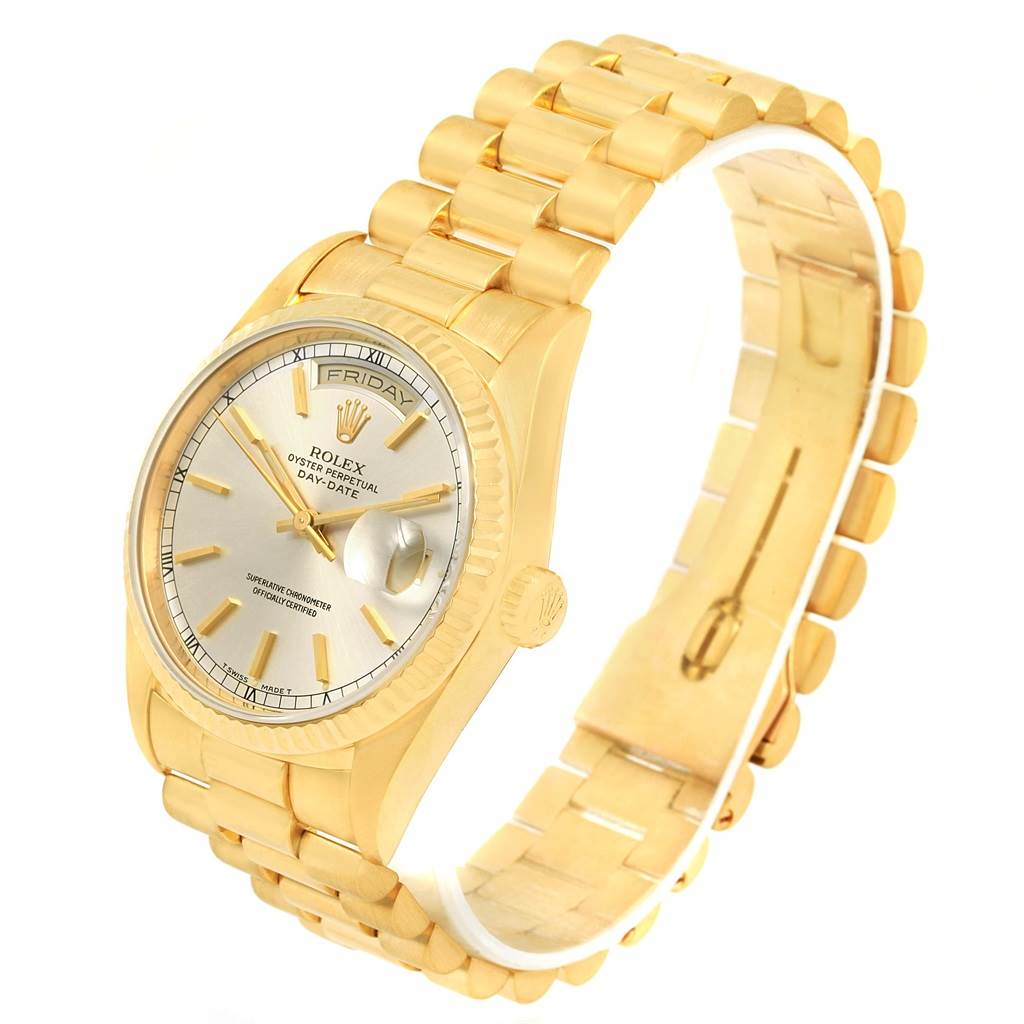 This image shows a Rolex President 18238 Men
s Yellow Gold Silver Dial 18238 Men
s Yellow Gold Silver Dial model watch at an oblique angle, revealing the face, case, and part of the band.