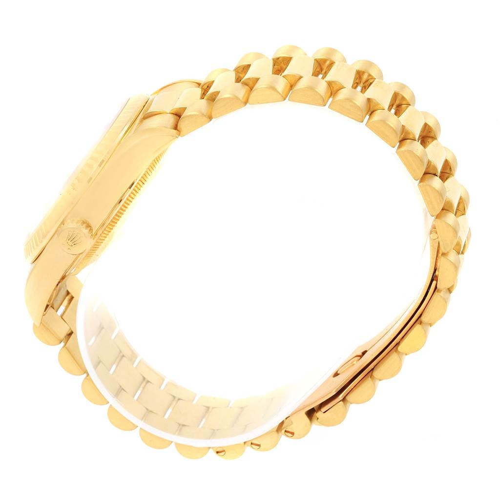 The image shows a side view of the band, case, and crown of a Rolex President 18238 Men
s Yellow Gold Silver Dial 18238 Men
s Yellow Gold Silver Dial watch.