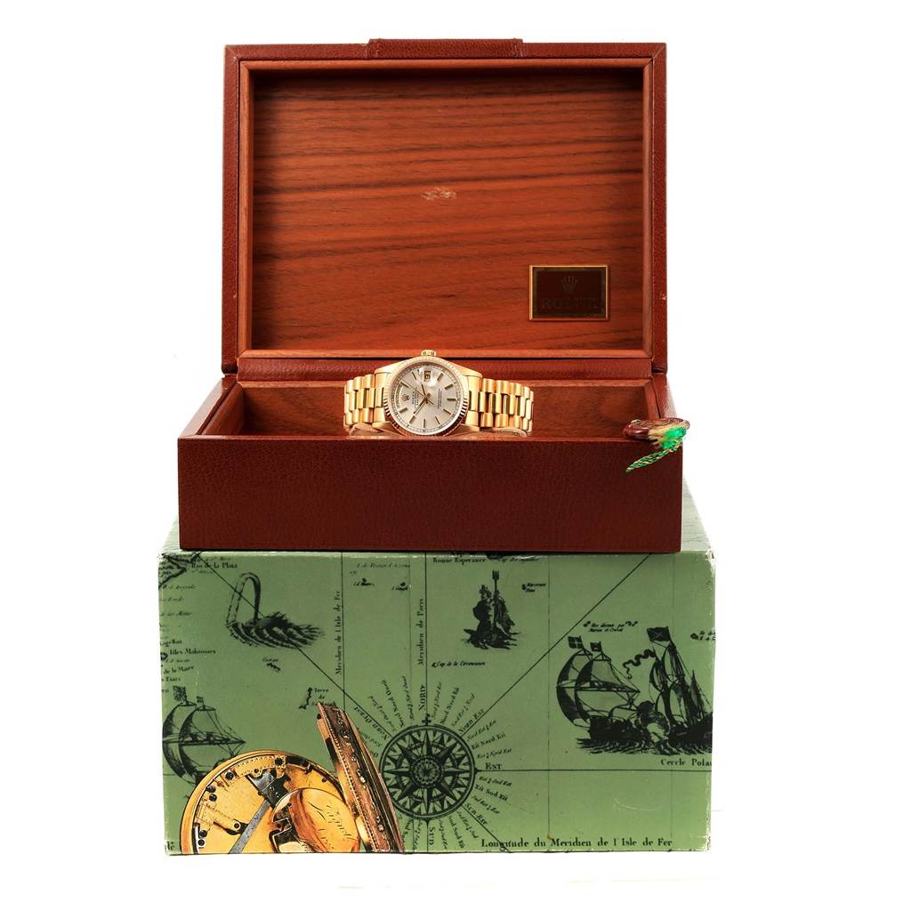 The image shows a Rolex President 18238 Men
s Yellow Gold Silver Dial 18238 Men
s Yellow Gold Silver Dial model watch displayed inside an open wooden box from a front angle.