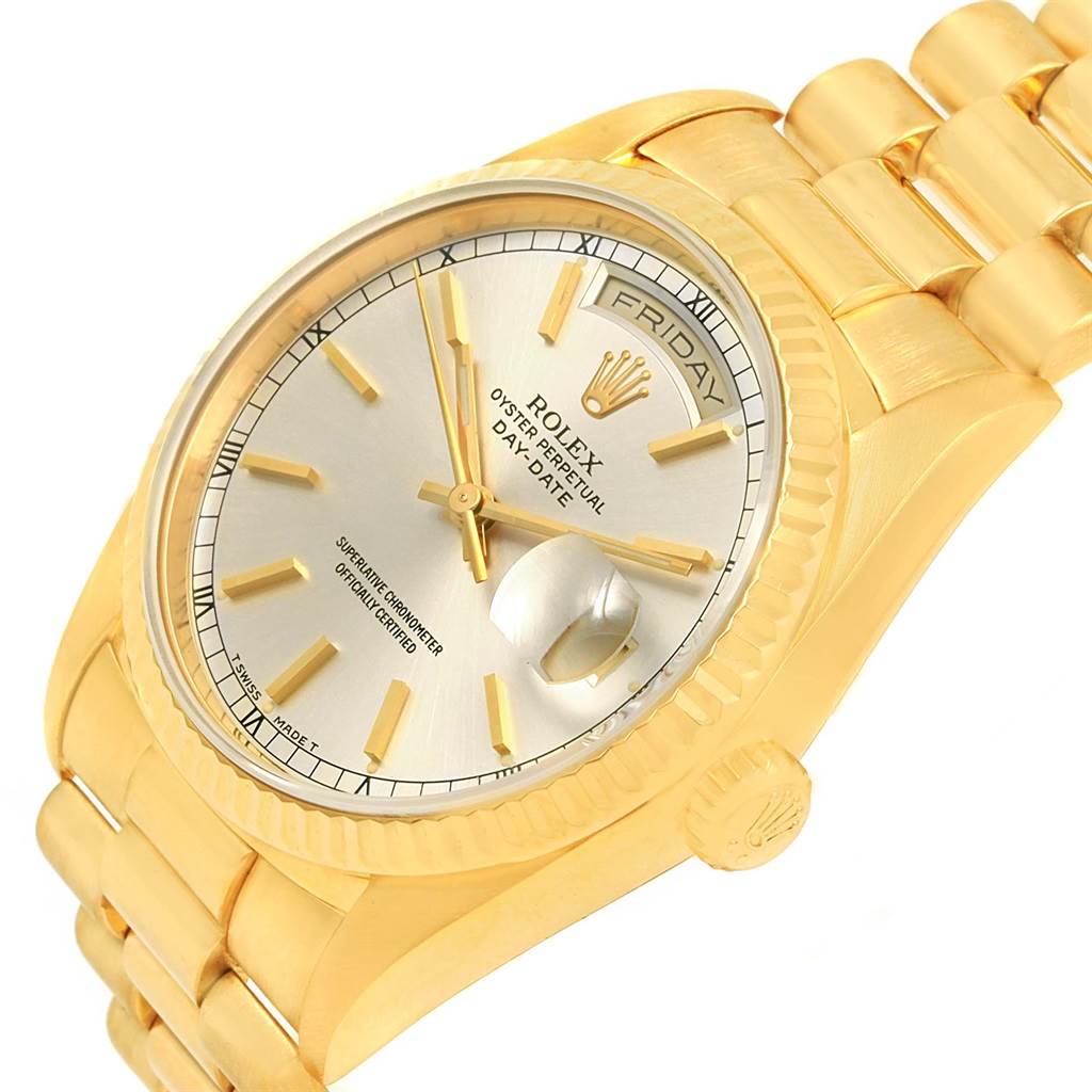 This image shows a close-up angle of the Rolex President 18238 Men
s Yellow Gold Silver Dial 18238 Men
s Yellow Gold Silver Dial model watch, highlighting its face, dial, and part of its band.