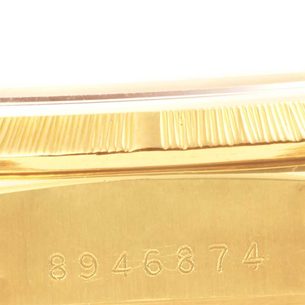 This image shows a close-up of the serial number engraved on the gold case of a Rolex President 18078 Men's Yellow Gold Champagne Dial 18078 Men's Yellow Gold Champagne Dial model watch.