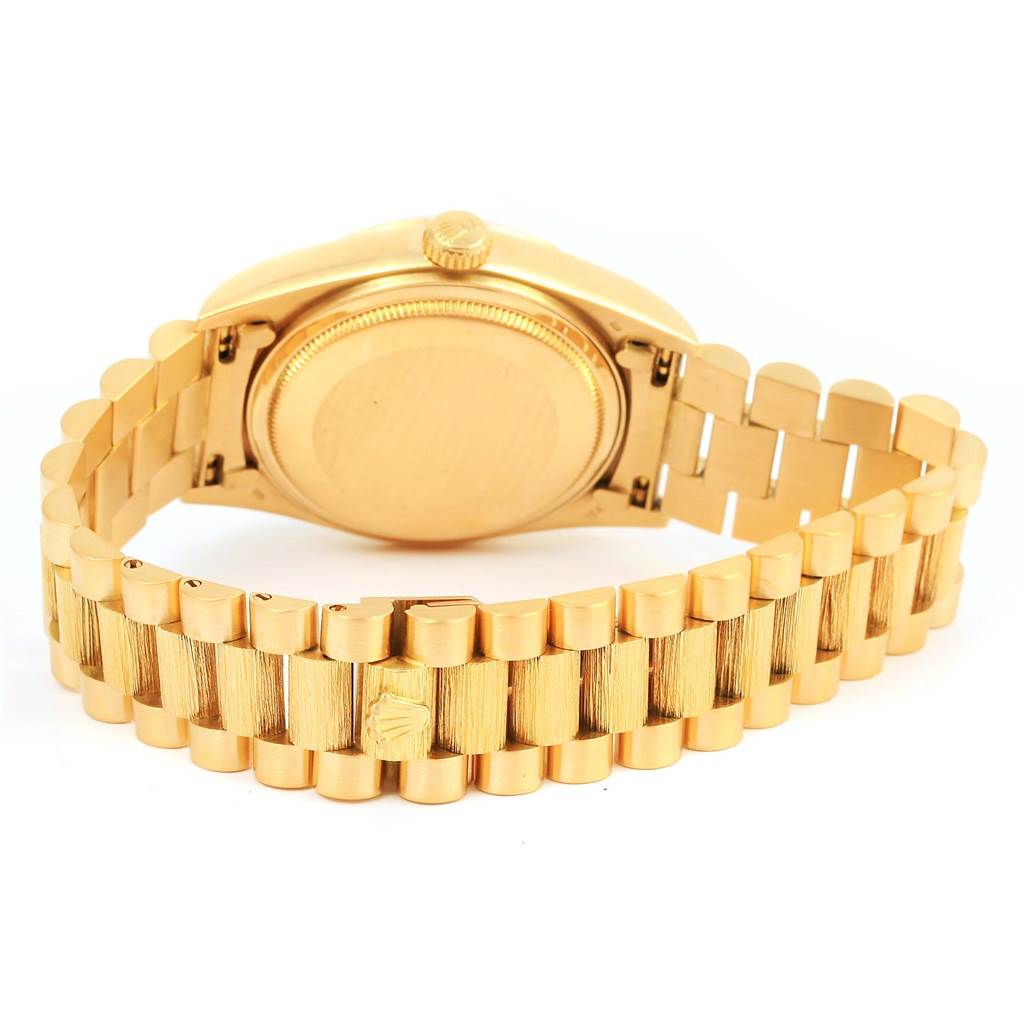 This image shows the back case and bracelet of a Rolex President 18078 Men's Yellow Gold Champagne Dial 18078 Men's Yellow Gold Champagne Dial watch, viewed from an angle slightly above and behind.