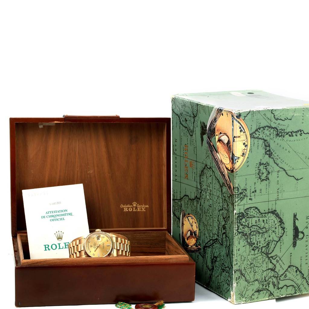 The image shows a Rolex President 18238 Men's Yellow Gold Champagne Dial 18238 Men's Yellow Gold Champagne Dial model watch in a wooden box with an instruction manual and an outer green box.