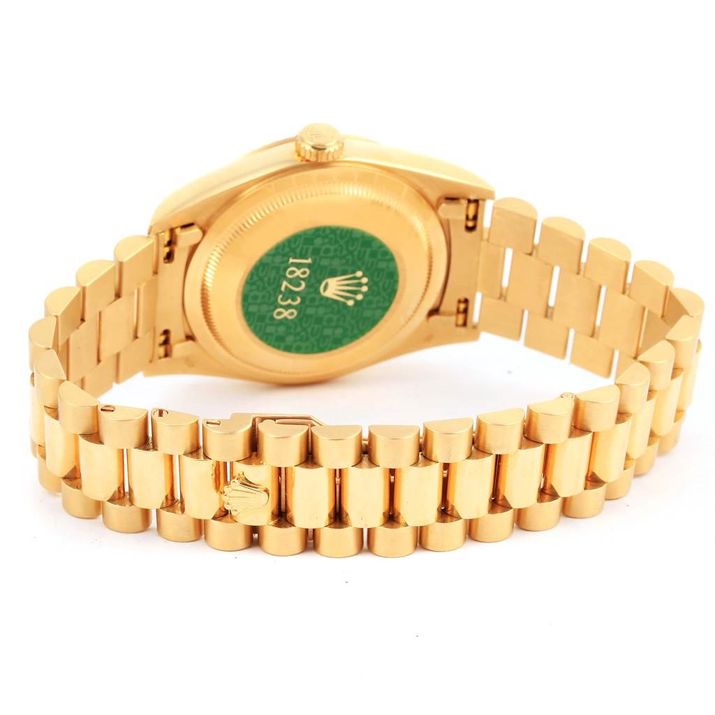 The image shows the back and bracelet of a Rolex President 18238 Men's Yellow Gold Champagne Dial 18238 Men's Yellow Gold Champagne Dial model watch, focusing on the case back and clasp.