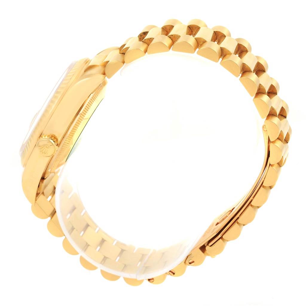 This image shows a side view of the Rolex President 18238 Men's Yellow Gold Champagne Dial 18238 Men's Yellow Gold Champagne Dial model watch highlighting its gold case and bracelet.