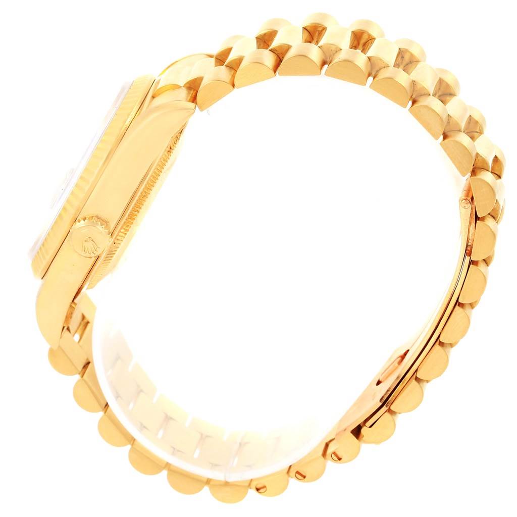 This image shows a side view of a Rolex President 18238 Men's Yellow Gold White Dial 18238 Men's Yellow Gold White Dial model watch, highlighting the crown and bracelet.