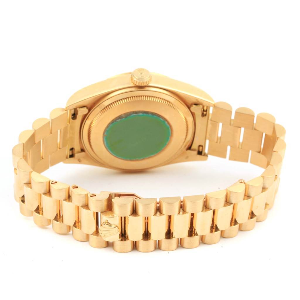 The image shows the back of the Rolex President 18038 Men's Yellow Gold Champagne Dial 18038 Men's Yellow Gold Champagne Dial model watch, with the gold case, crown, and bracelet.