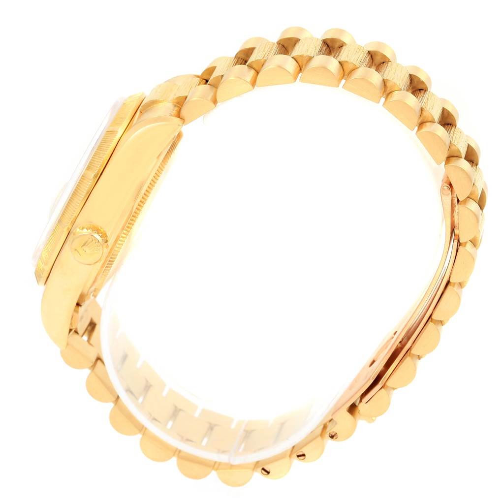 This image shows a side view of the Rolex President 18078 Men's Yellow Gold Champagne Dial 18078 Men's Yellow Gold Champagne Dial model watch showcasing its gold bracelet and side case.