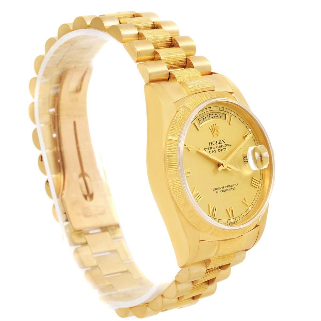 This image shows a Rolex President 18078 Men's Yellow Gold Champagne Dial 18078 Men's Yellow Gold Champagne Dial model watch at an angle, highlighting the gold bracelet and dial, and partially displaying the day and date.