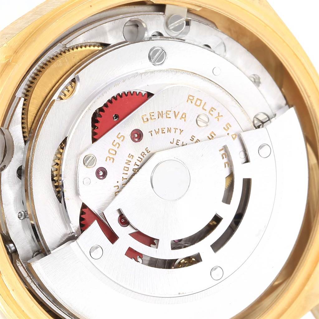 This image shows a close-up of the movement mechanism inside a Rolex President 18078 Men's Yellow Gold Champagne Dial 18078 Men's Yellow Gold Champagne Dial watch, highlighting gears and intricate parts.